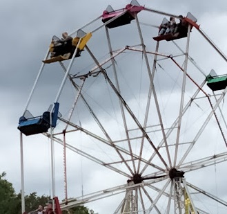 Riders on a Ferris Wheel Ferris Wheel funfair ride