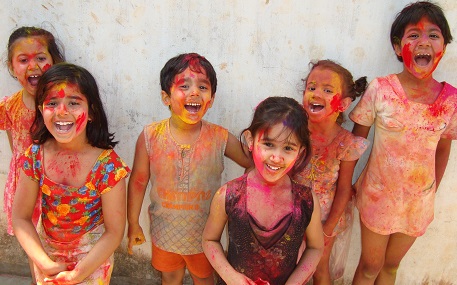 Children celebrating Holi funfair ride for Holi