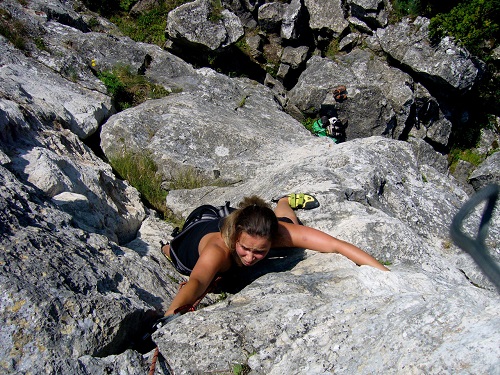 woman climbing rock wall rock wall climber