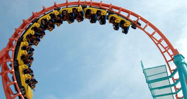 An upside-down roller-coaster on a looping track Upside-down looping rollercoaster carriage